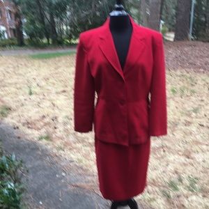 Red suit including jacket and skirt.